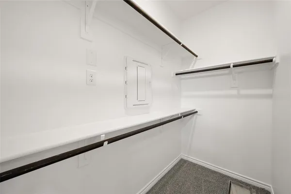 a bathroom with a double vanity sink and mirror