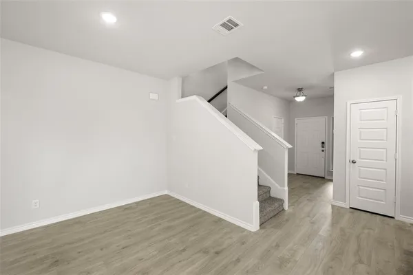 a large kitchen with stainless steel appliances granite countertop a stove and a sink