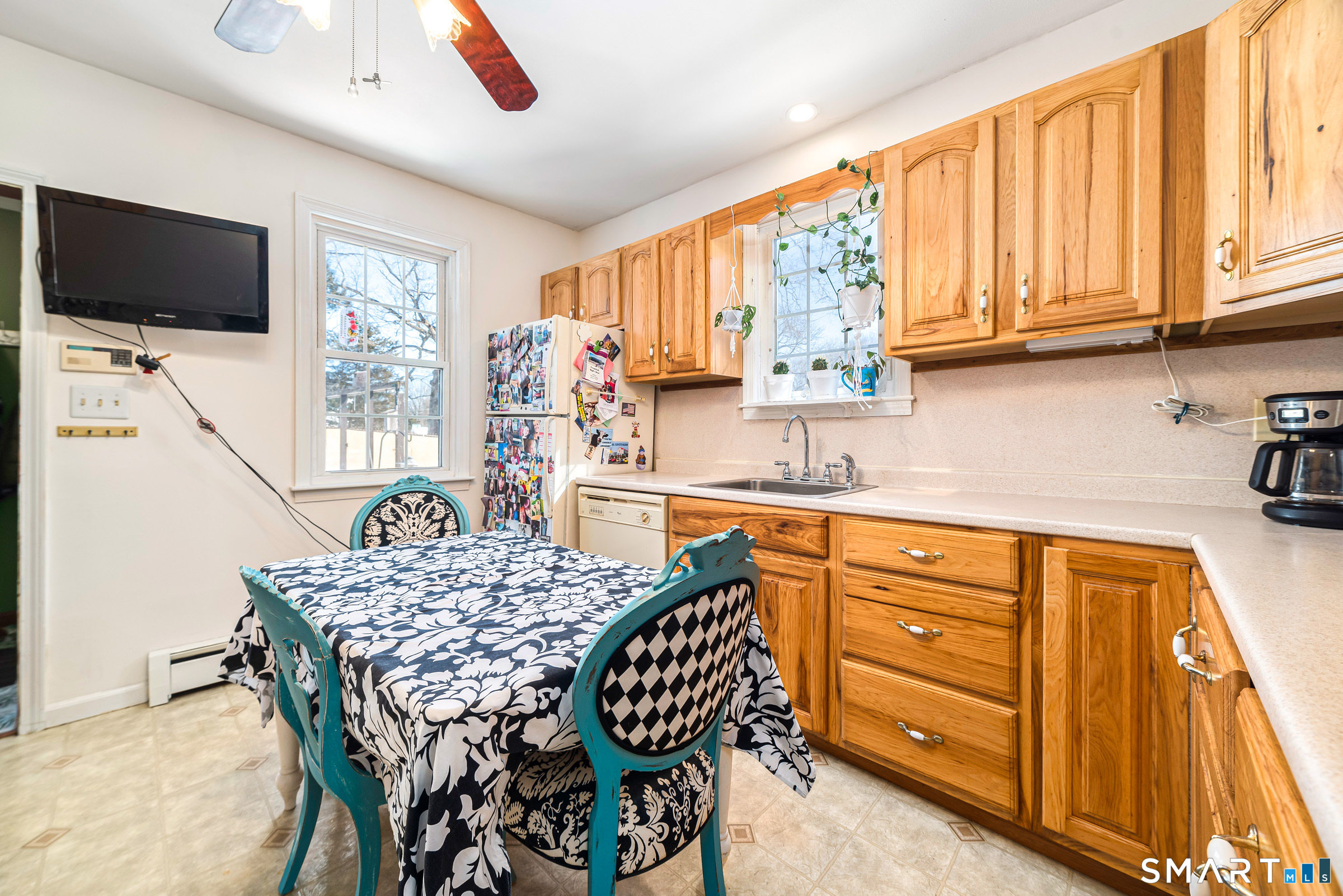 11 Willard Avenue Enfield, CT 06082 - Photo 12 of 30 a kitchen with stainless steel appliances a stove a sink dishwasher and a microwave