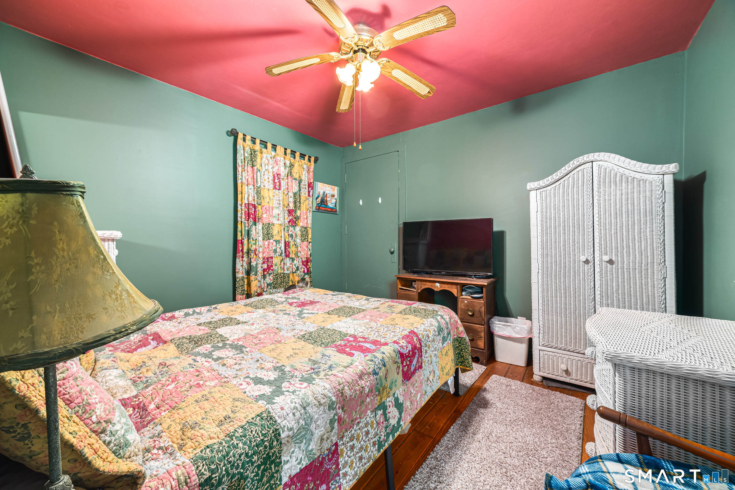 11 Willard Avenue Enfield, CT 06082 - Photo 19 of 30 a bedroom with a bed and a flat screen tv