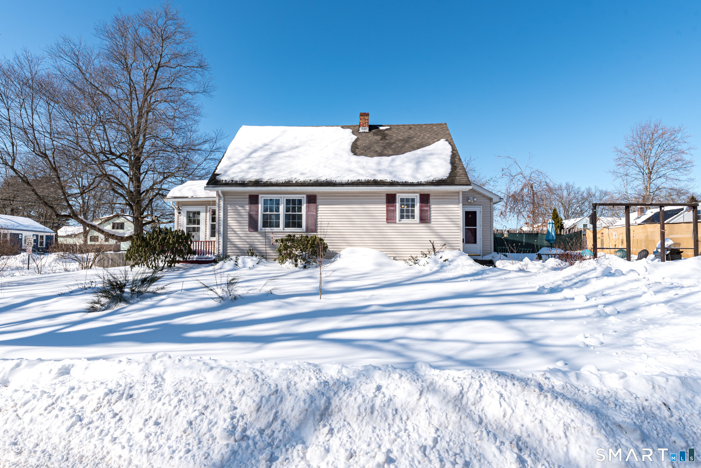 11 Willard Avenue Enfield, CT 06082 - Photo 29 of 30 a view of a white house with a large tree in front of it