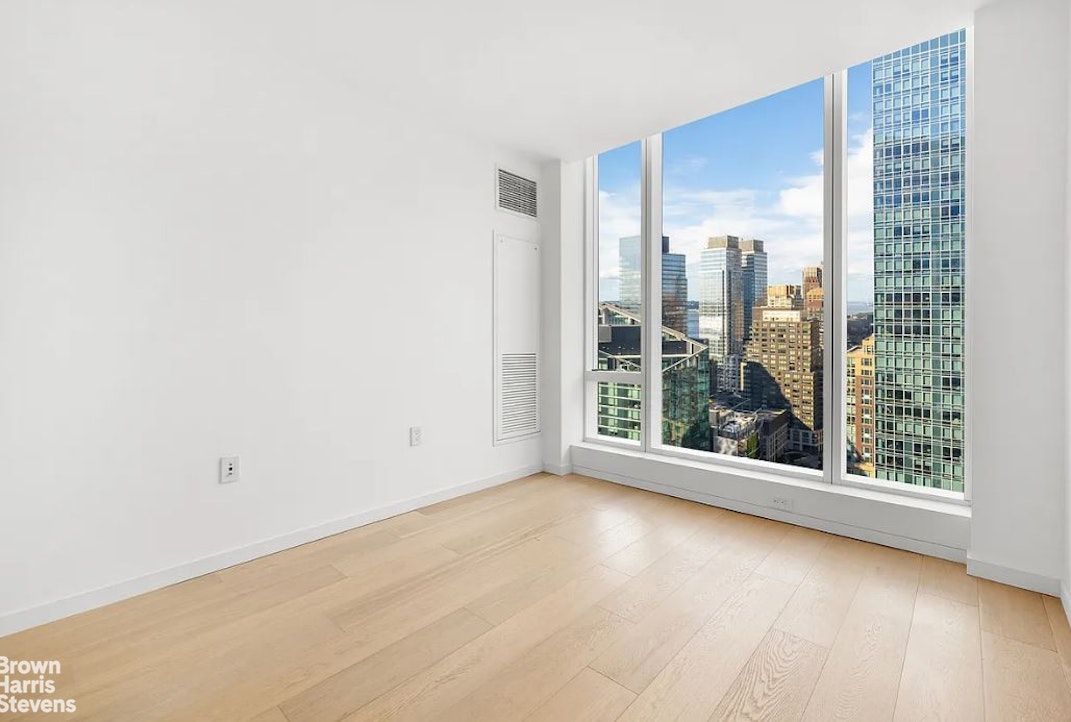 1 West End Avenue, Unit 28H Manhattan, NY 10069 - Photo 11 of 20 a view of a room with a large window
