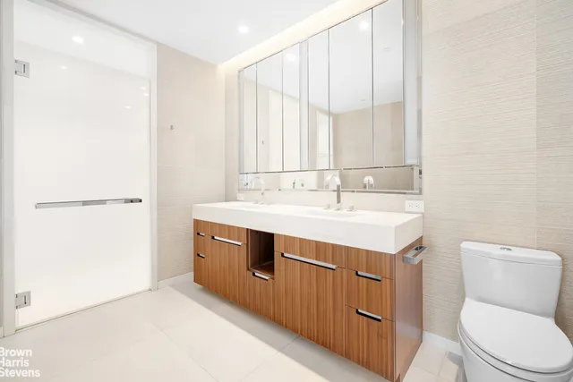 a bathroom with a sink a toilet and vanity