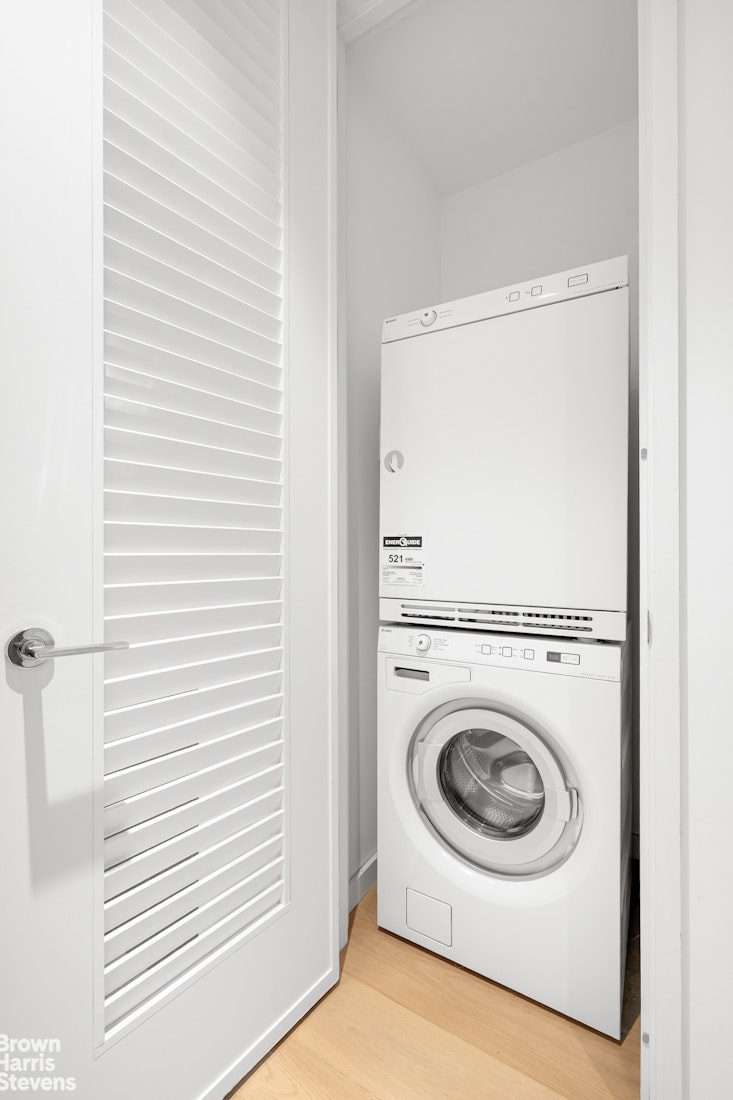 1 West End Avenue, Unit 28H Manhattan, NY 10069 - Photo 16 of 20 a utility room with dryer and washer