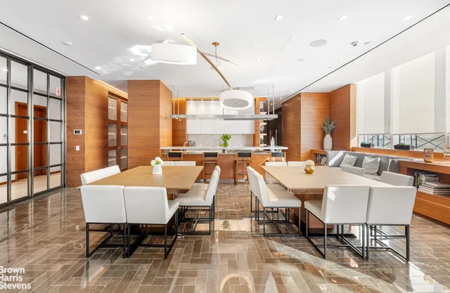 a very nice looking dining room with lots of furniture and a rug