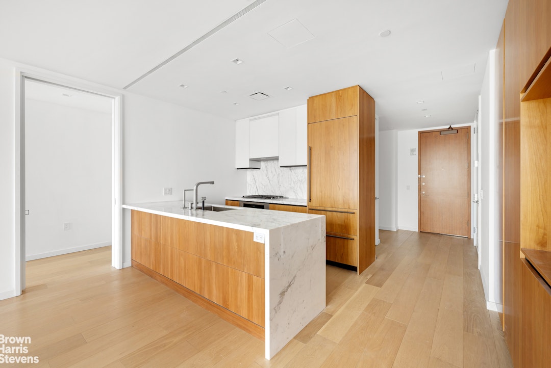 1 West End Avenue, Unit 28H Manhattan, NY 10069 - Photo 5 of 20 a kitchen with stainless steel appliances granite countertop a refrigerator a sink and a stove