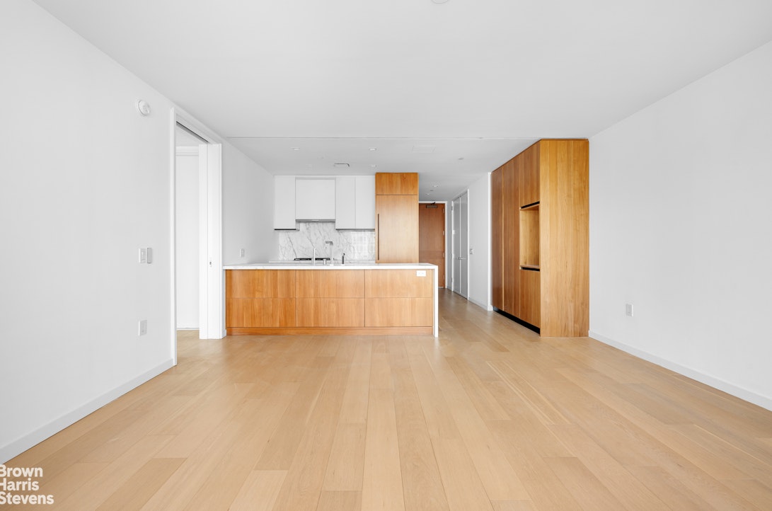 1 West End Avenue, Unit 28H Manhattan, NY 10069 - Photo 6 of 20 a view of a bedroom with cabinet and natural light