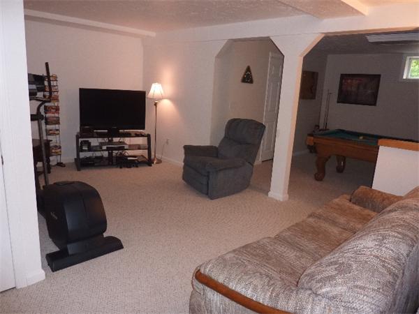 12 Nehemiah Road Shirley, MA 01464 - Photo 12 of 17 a living room with furniture and a flat screen tv