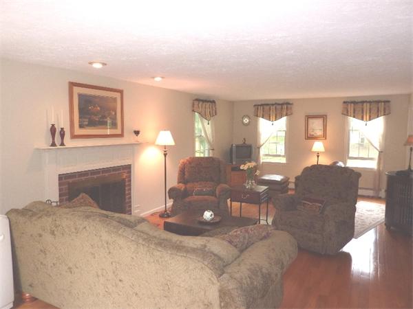 12 Nehemiah Road Shirley, MA 01464 - Photo 6 of 17 a living room with furniture and a fireplace