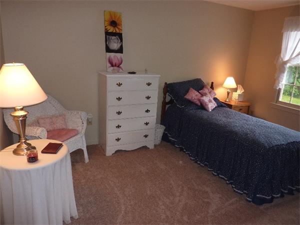 12 Nehemiah Road Shirley, MA 01464 - Photo 9 of 17 a bedroom with a bed and a window