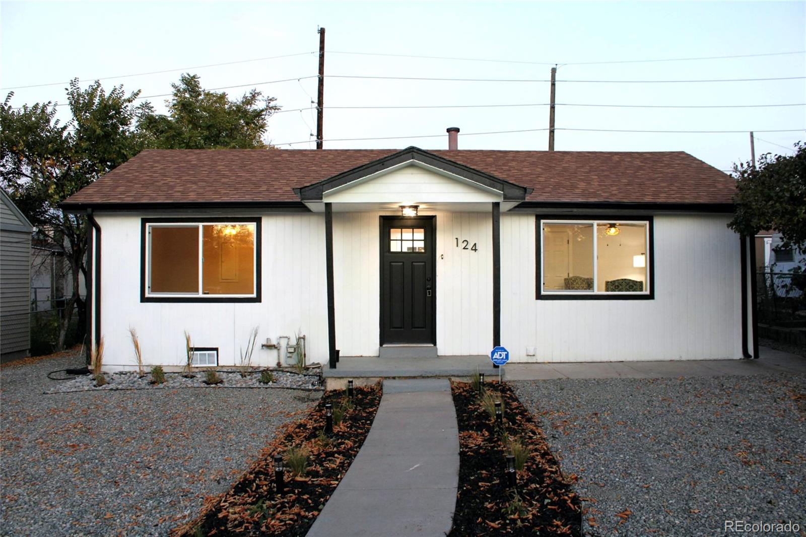 124 South Grove Street Denver, CO 80219 - Photo 1 of 25 a front view of a house with a yard