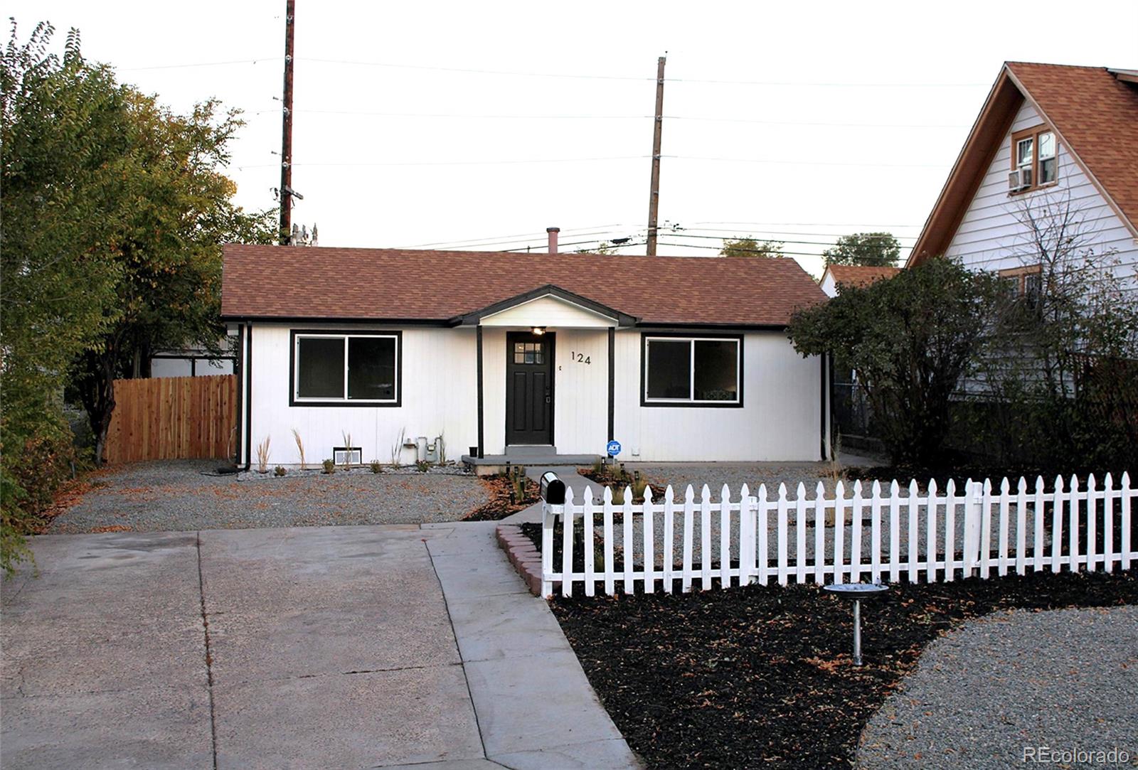 124 South Grove Street Denver, CO 80219 - Photo 18 of 25 a front view of a house with a fence