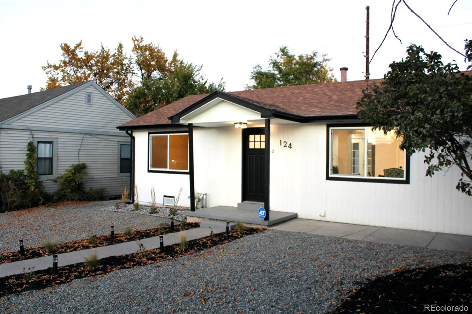 124 South Grove Street Denver, CO 80219 - Photo 19 of 25 a front view of a house with a yard