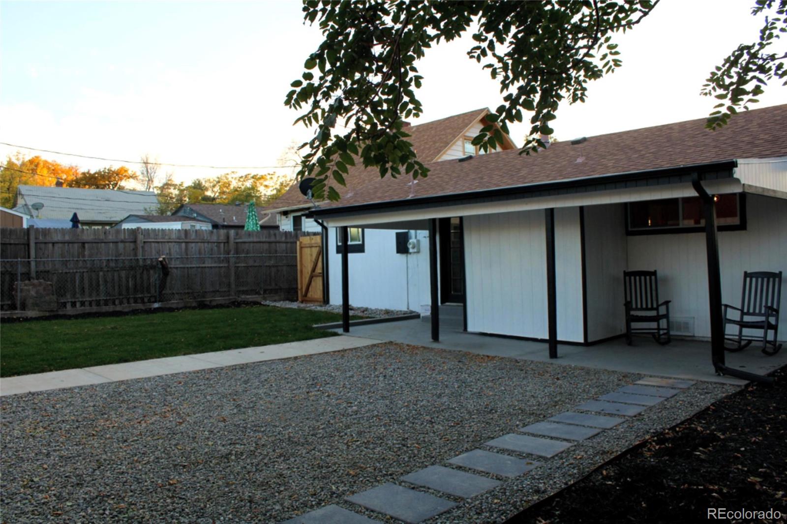 124 South Grove Street Denver, CO 80219 - Photo 21 of 25 a view of a house with a yard