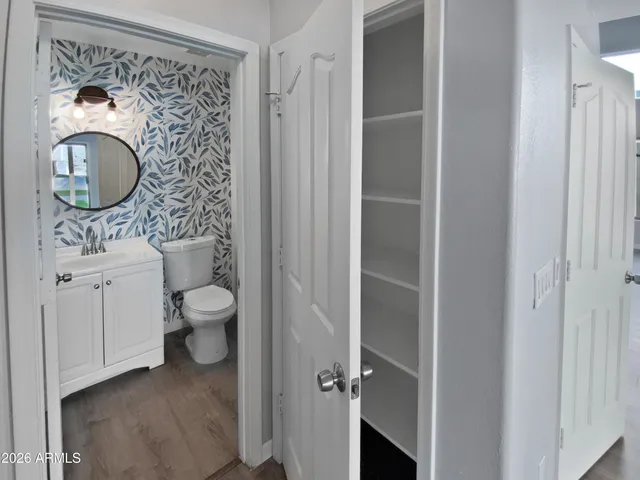 a bathroom with a toilet and a sink