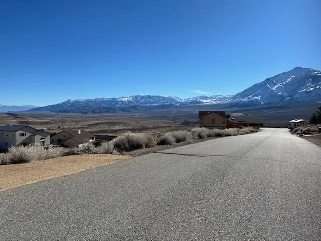 a view of a car parked in middle of a field