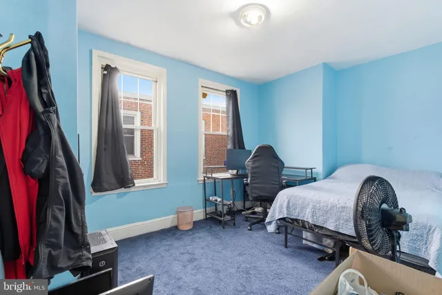 a bedroom with bed and a window