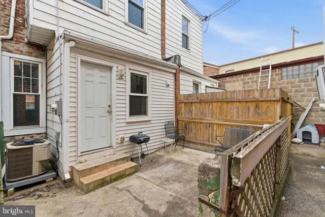 a view of a house with stairs and a large window