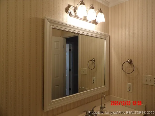 a bathroom with a shower and a sink