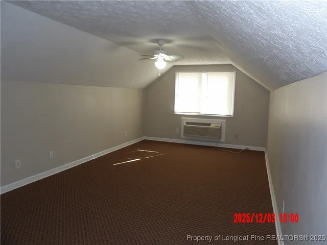 an empty room with a empty space and windows