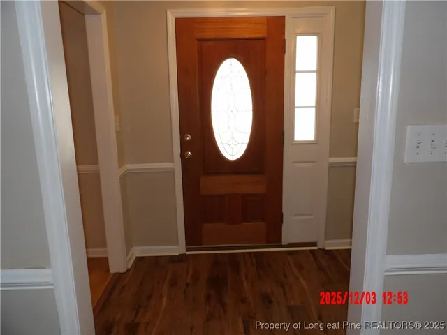 a view of a door with wooden floor
