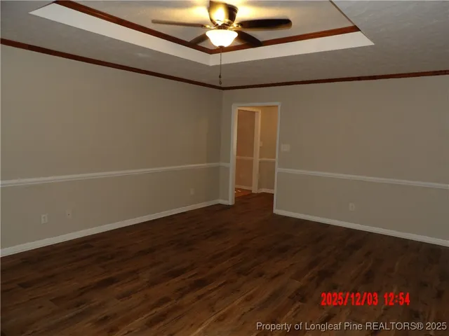 a view of an empty room with a fan