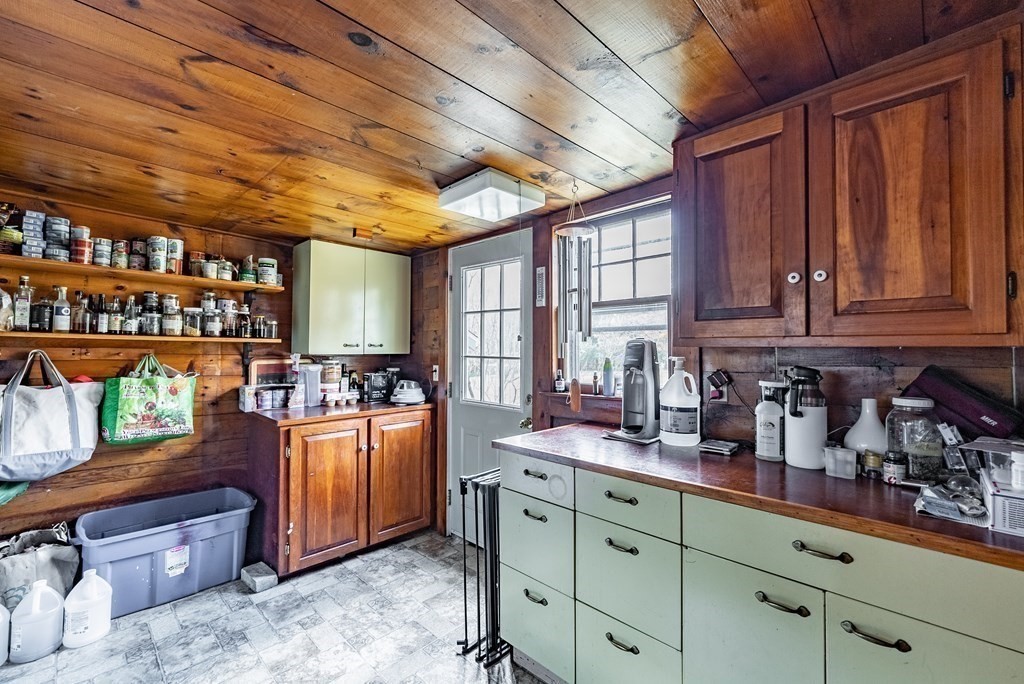 65 Old Bay Road Belchertown, MA 01007 - Photo 14 of 42 a kitchen with stainless steel appliances granite countertop a stove a sink dishwasher and cabinets with wooden floor