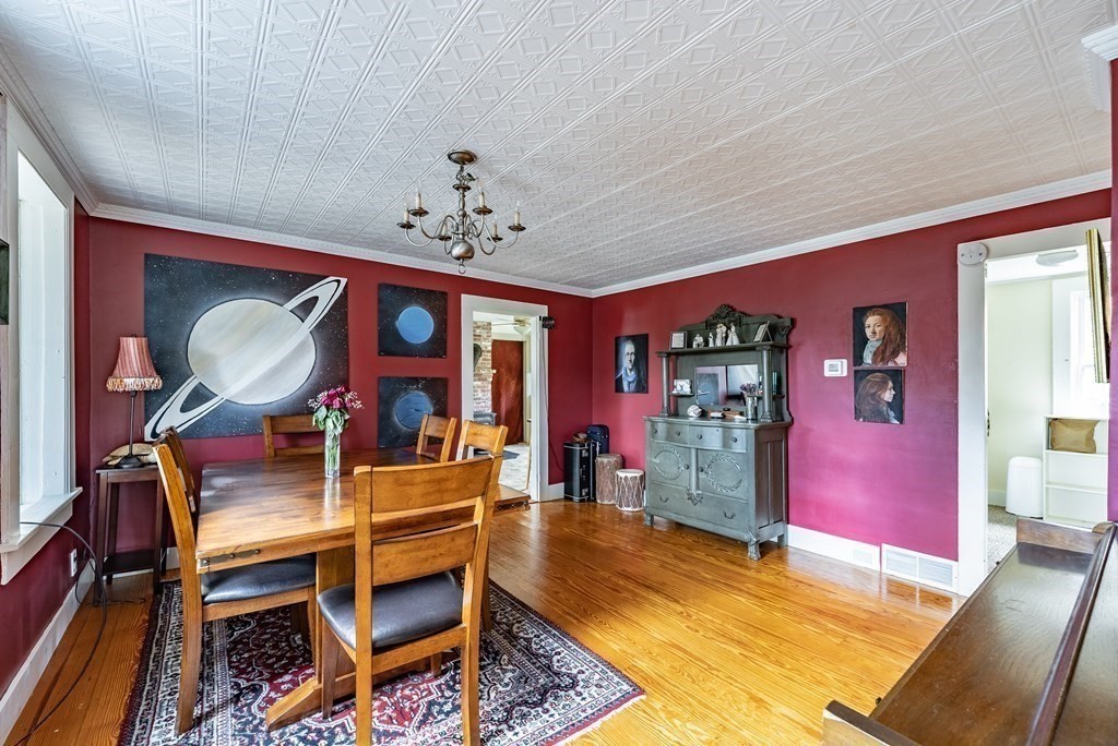 65 Old Bay Road Belchertown, MA 01007 - Photo 21 of 42 a view of a dining room with furniture and chandelier