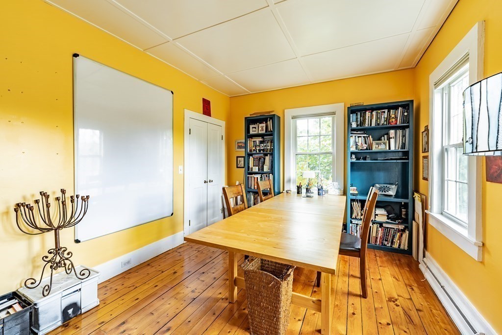 65 Old Bay Road Belchertown, MA 01007 - Photo 22 of 42 a living room with stainless steel appliances furniture a rug and a large window
