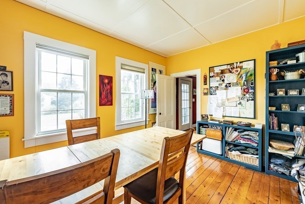 65 Old Bay Road Belchertown, MA 01007 - Photo 24 of 42 a living room with furniture and a flat screen tv