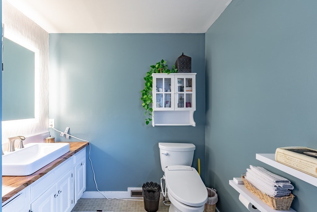 65 Old Bay Road Belchertown, MA 01007 - Photo 25 of 42 a bathroom with a toilet sink and mirror