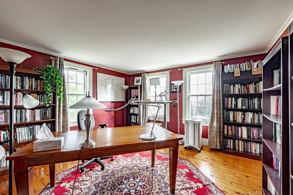 65 Old Bay Road Belchertown, MA 01007 - Photo 28 of 42 a living room with furniture a bookshelf and a window