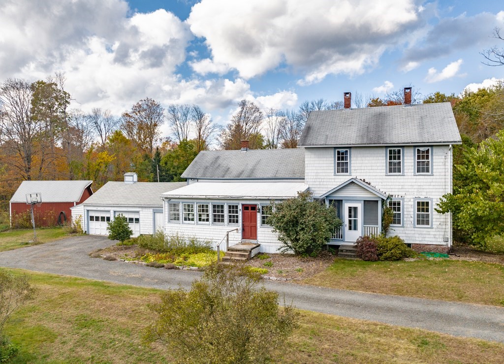 65 Old Bay Road Belchertown, MA 01007 - Photo 39 of 42 a front view of residential houses with yard and swimming pool
