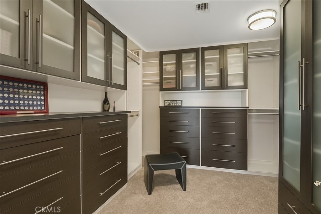 402 Rockefeller, Unit 118 Irvine, CA 92612 - Photo 12 of 24 a bathroom with a sink and a mirror