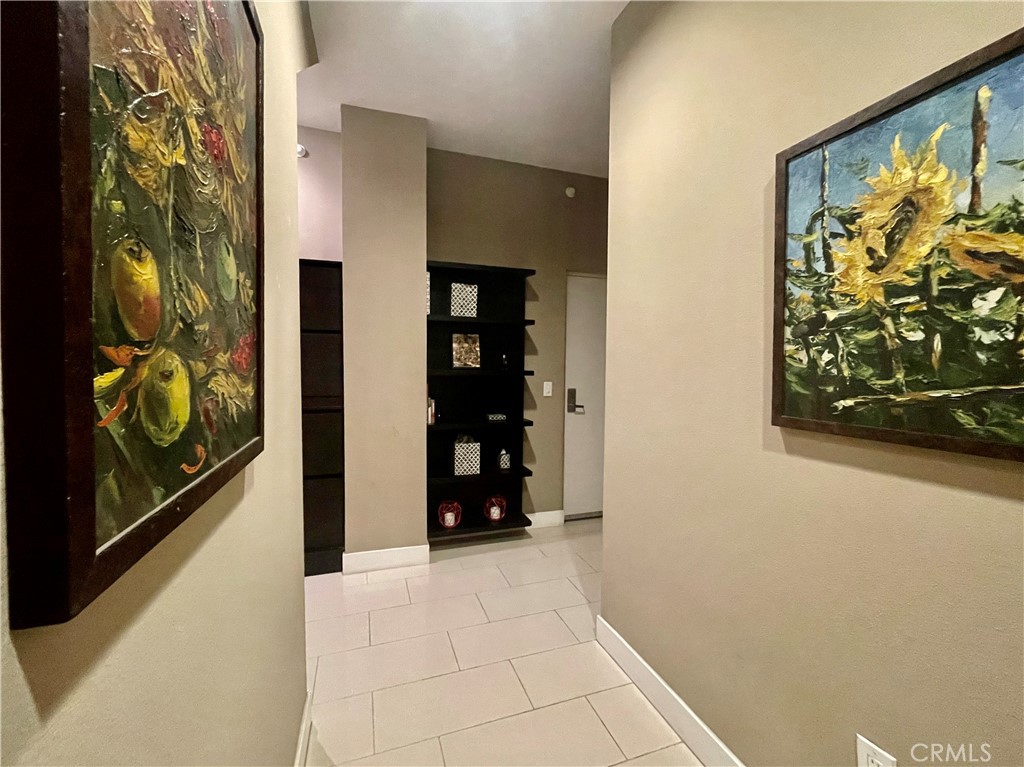 402 Rockefeller, Unit 118 Irvine, CA 92612 - Photo 19 of 24 a view of walk in closet with clothes and shoes