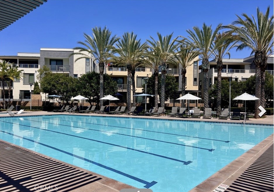 402 Rockefeller, Unit 118 Irvine, CA 92612 - Photo 24 of 24 a front view of a house with swimming pool having outdoor seating