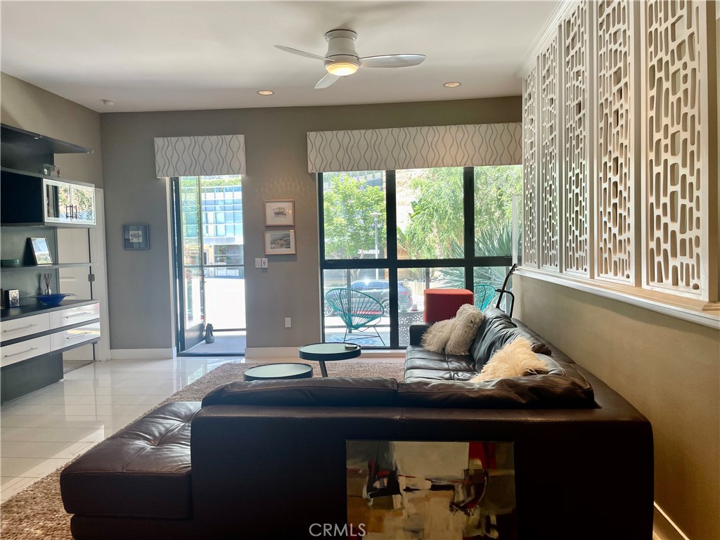 402 Rockefeller, Unit 118 Irvine, CA 92612 - Photo 8 of 24 a living room with furniture and a window