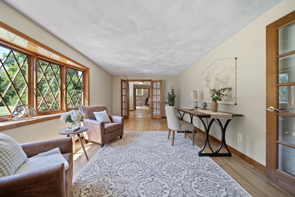 21 Cranberry Road Pepperell, MA 01463 - Photo 15 of 41 a living room with furniture and a large window
