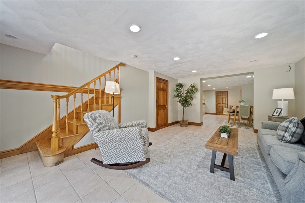 21 Cranberry Road Pepperell, MA 01463 - Photo 17 of 41 a living room with furniture gym equipment and a large window