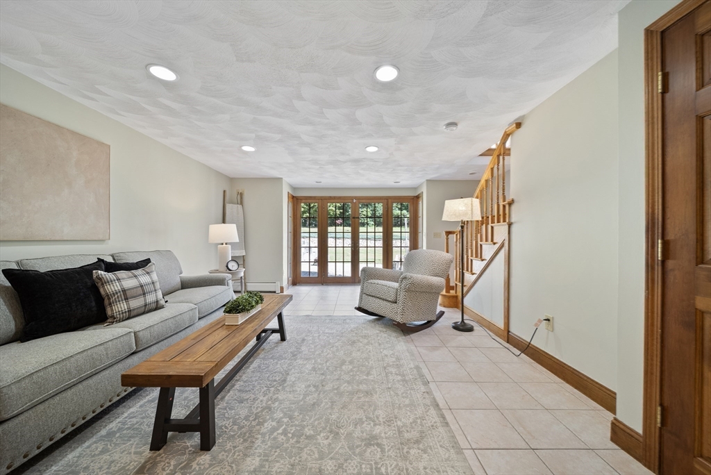 21 Cranberry Road Pepperell, MA 01463 - Photo 19 of 41 a living room with furniture and a table