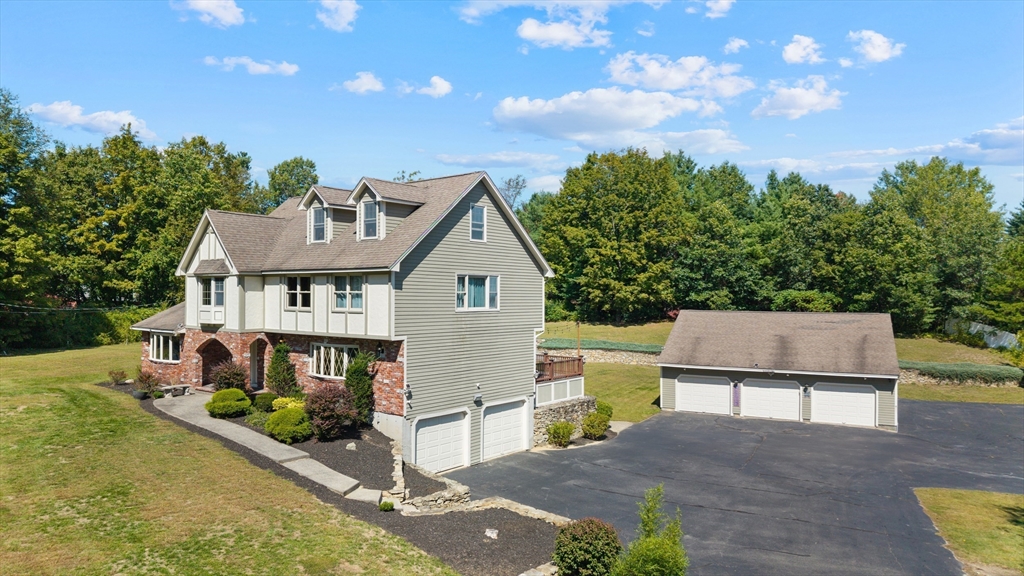 21 Cranberry Road Pepperell, MA 01463 - Photo 2 of 41 a view of a house with a yard and potted plants