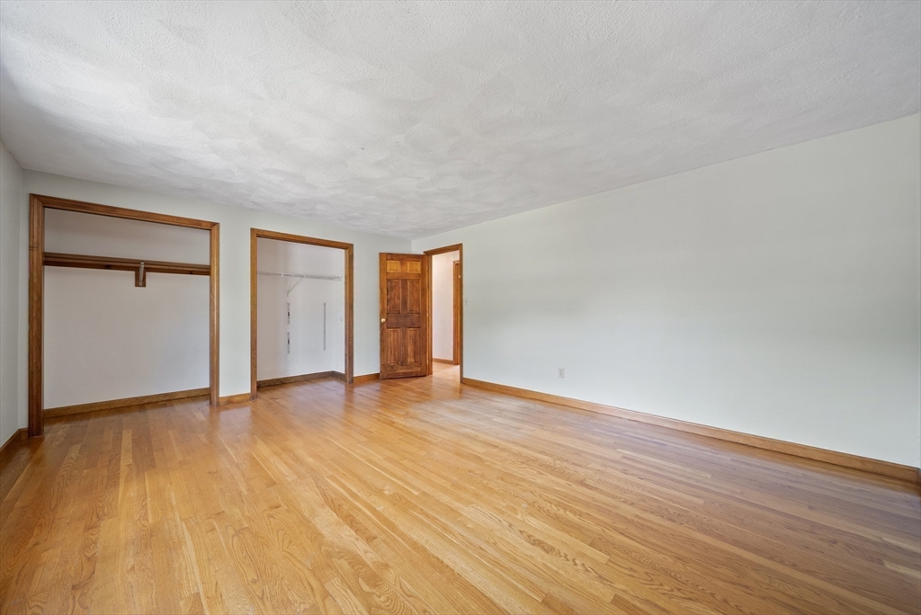 21 Cranberry Road Pepperell, MA 01463 - Photo 32 of 41 a view of an empty room with wooden floor and a window
