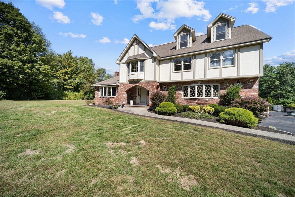 21 Cranberry Road Pepperell, MA 01463 - Photo 40 of 41 a front view of a house with garden