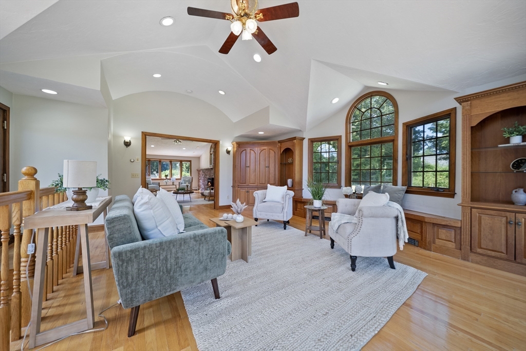 21 Cranberry Road Pepperell, MA 01463 - Photo 9 of 41 a living room with fireplace furniture and a large window