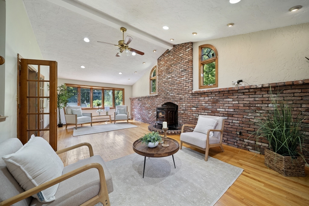 21 Cranberry Road Pepperell, MA 01463 - Photo 10 of 41 a living room with furniture and a fireplace