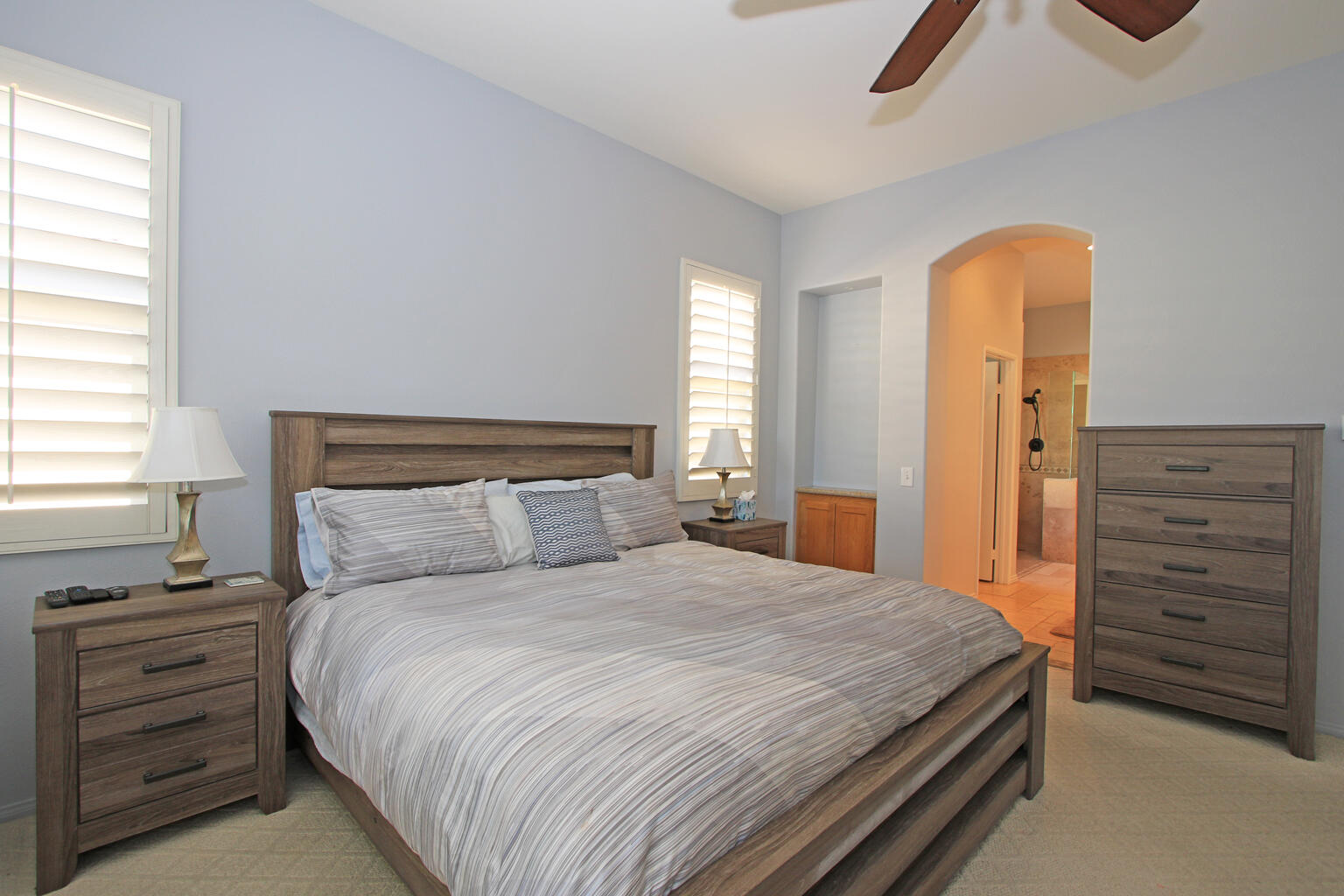 82652 Sky View Lane Indio, CA 92201 - Photo 21 of 44 a bedroom with a bed and a dresser