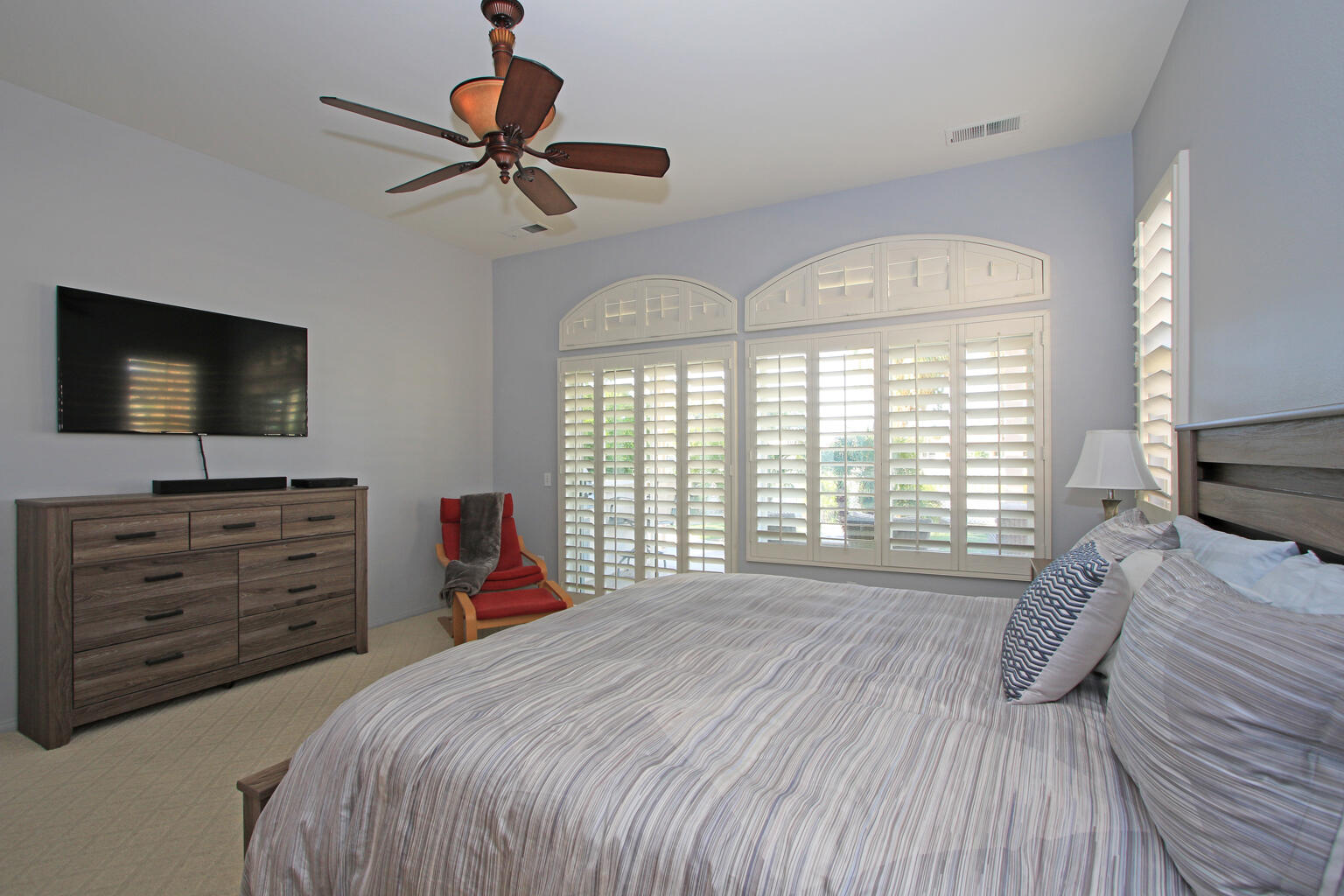 82652 Sky View Lane Indio, CA 92201 - Photo 22 of 44 a bedroom with a bed and a flat screen tv