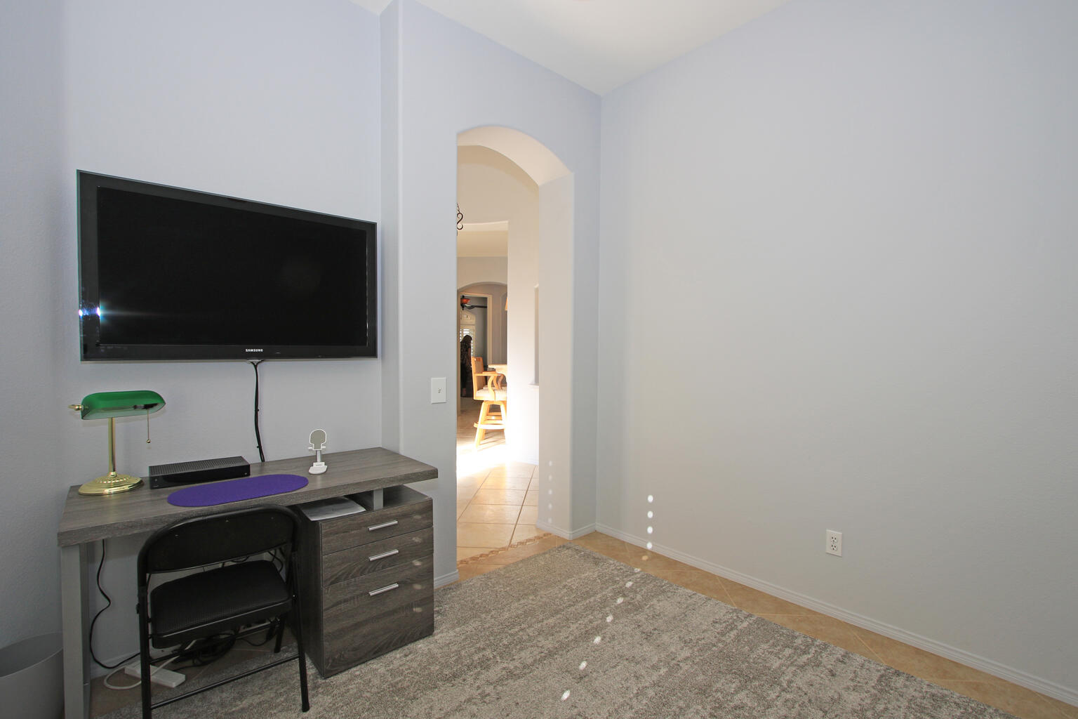 82652 Sky View Lane Indio, CA 92201 - Photo 23 of 44 a living room with a flat screen tv and a window