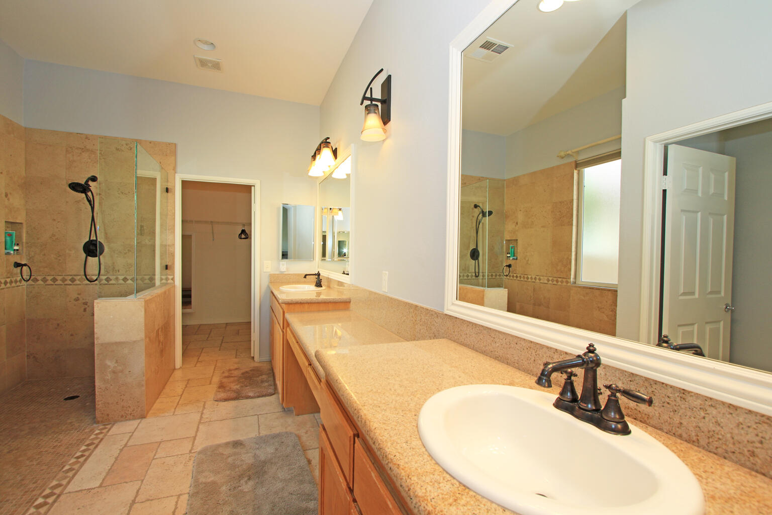 82652 Sky View Lane Indio, CA 92201 - Photo 24 of 44 a bathroom with a tub sink and mirror