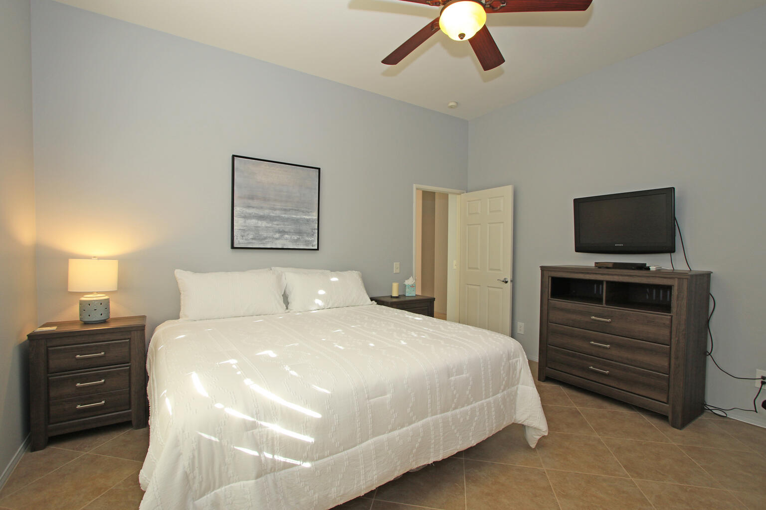 82652 Sky View Lane Indio, CA 92201 - Photo 28 of 44 a bedroom with a bed and a tv